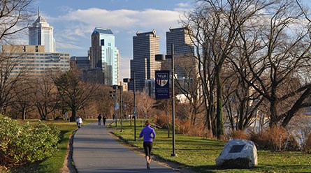 a woman running on a trail